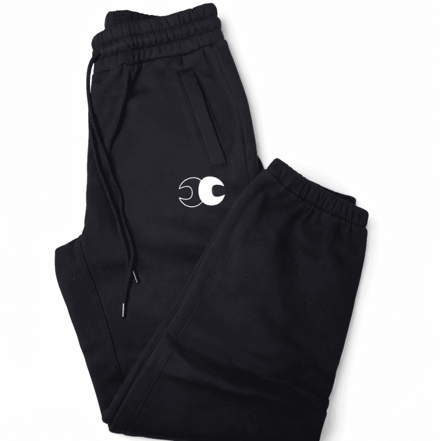 Conscious Choice Foundation Sweatpants in black featuring a relaxed oversized unisex fit, premium fleece-lined fabric, and minimalist logo detailing.
